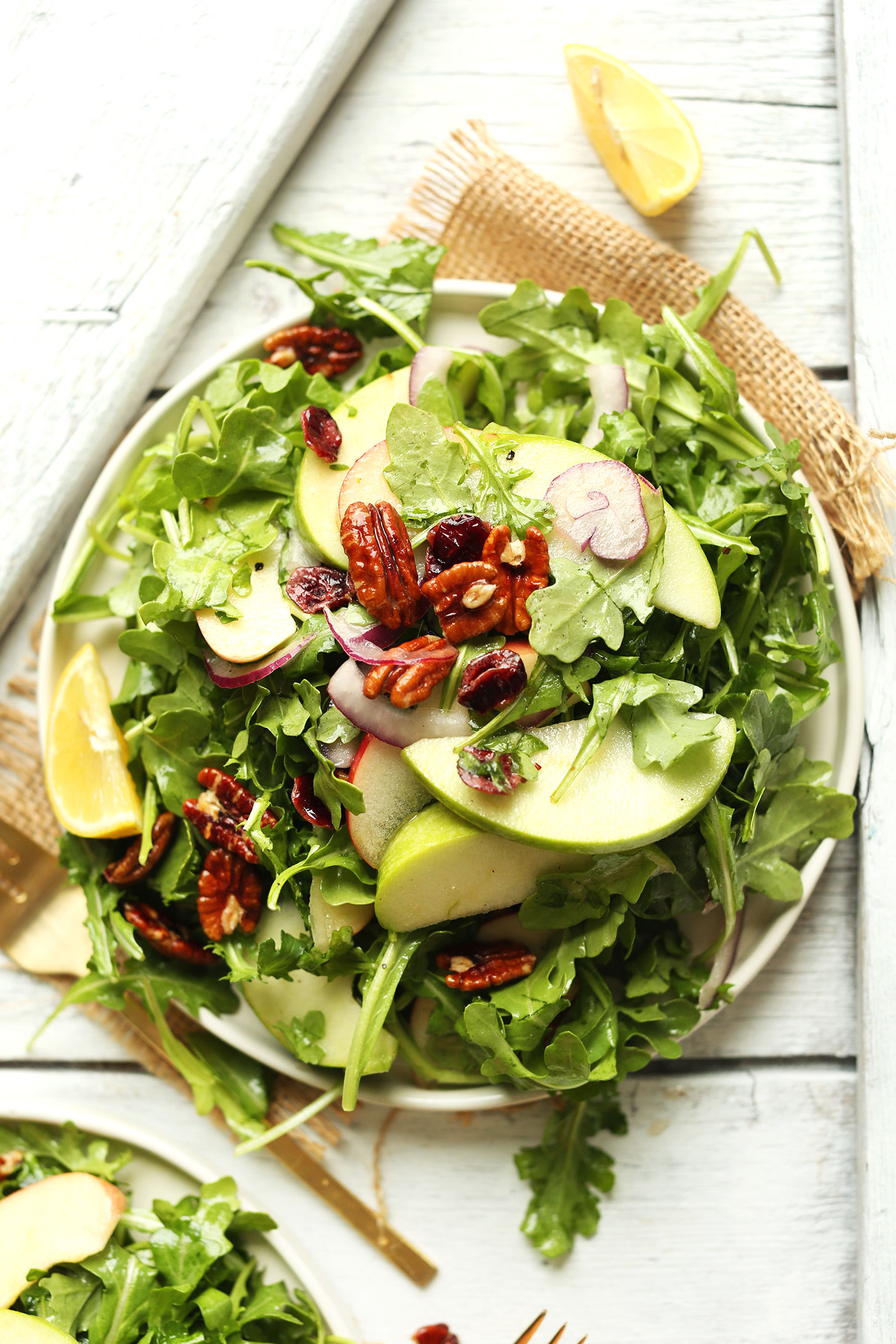 Big plate of our recipe for Apple Arugula Salad with Pecans and Lemon Vinaigrette