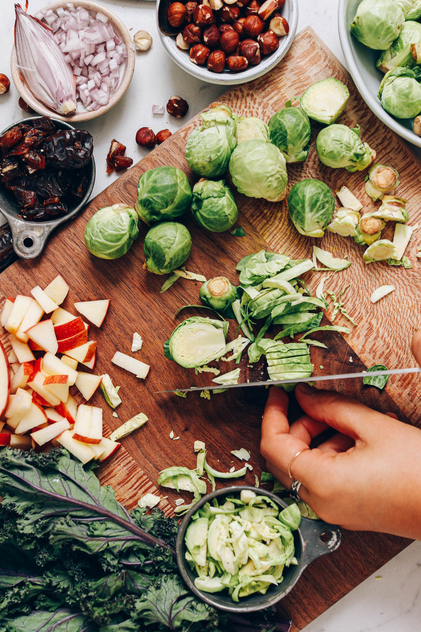 Showing how to shave Brussels sprouts