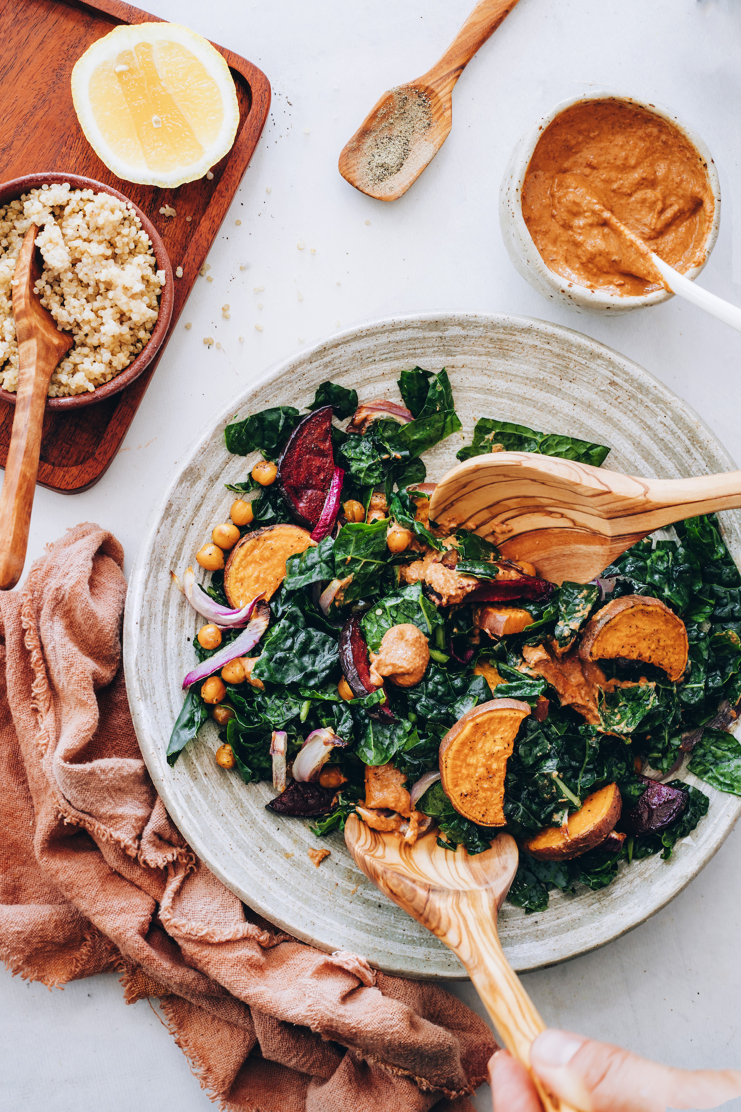 Bowl of kale with roasted vegetables and chipotle pecan pesto