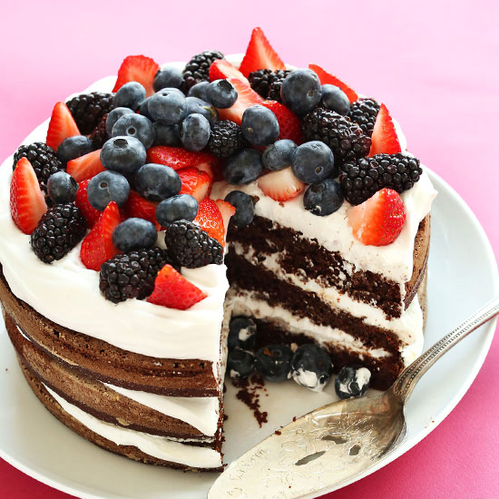 Triple layer Vegan Gluten-Free Chocolate Cake topped with fresh berries