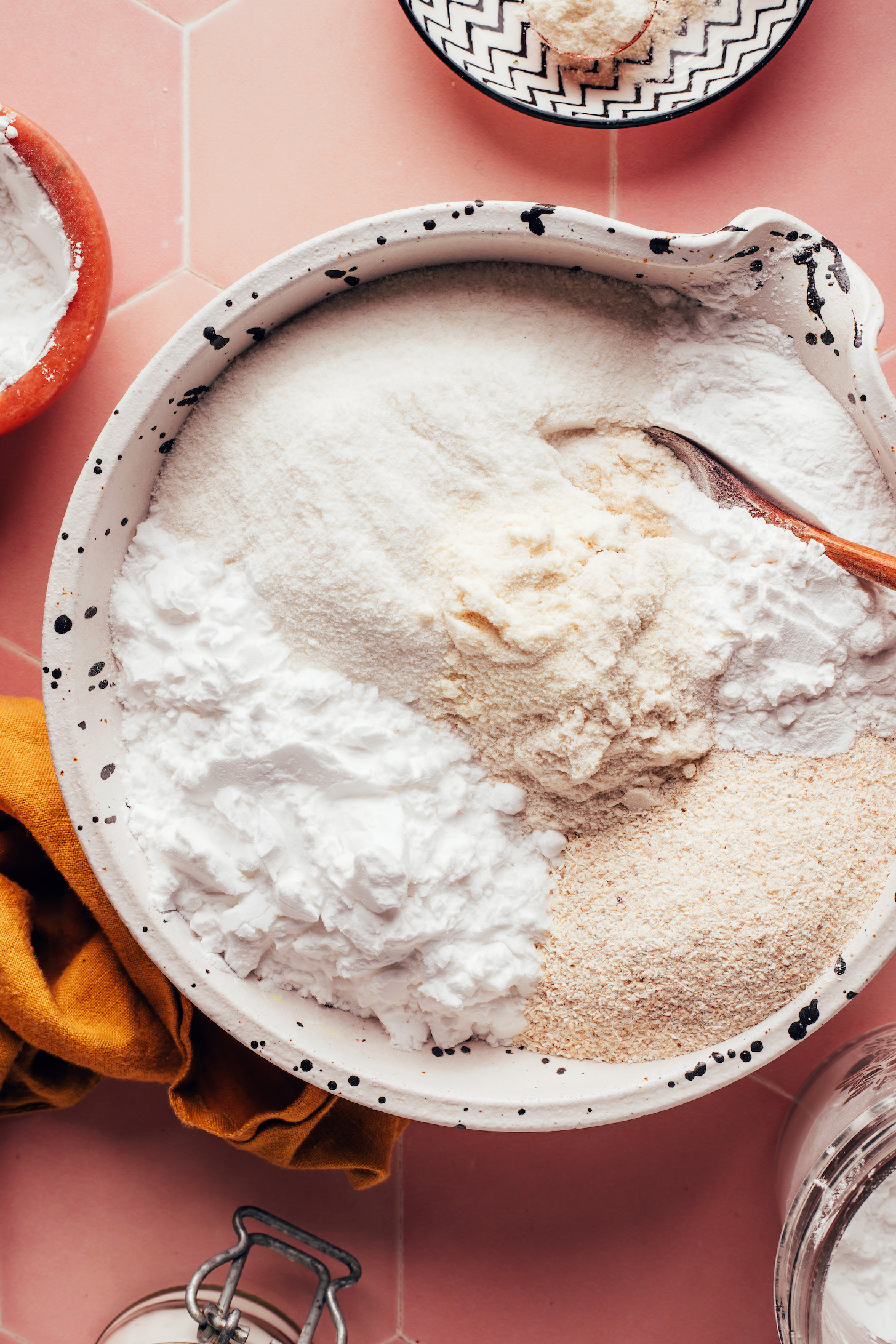 Bowl with brown rice flour, potato starch, white rice flour, cassava flour, tapioca flour, and xanthan gum