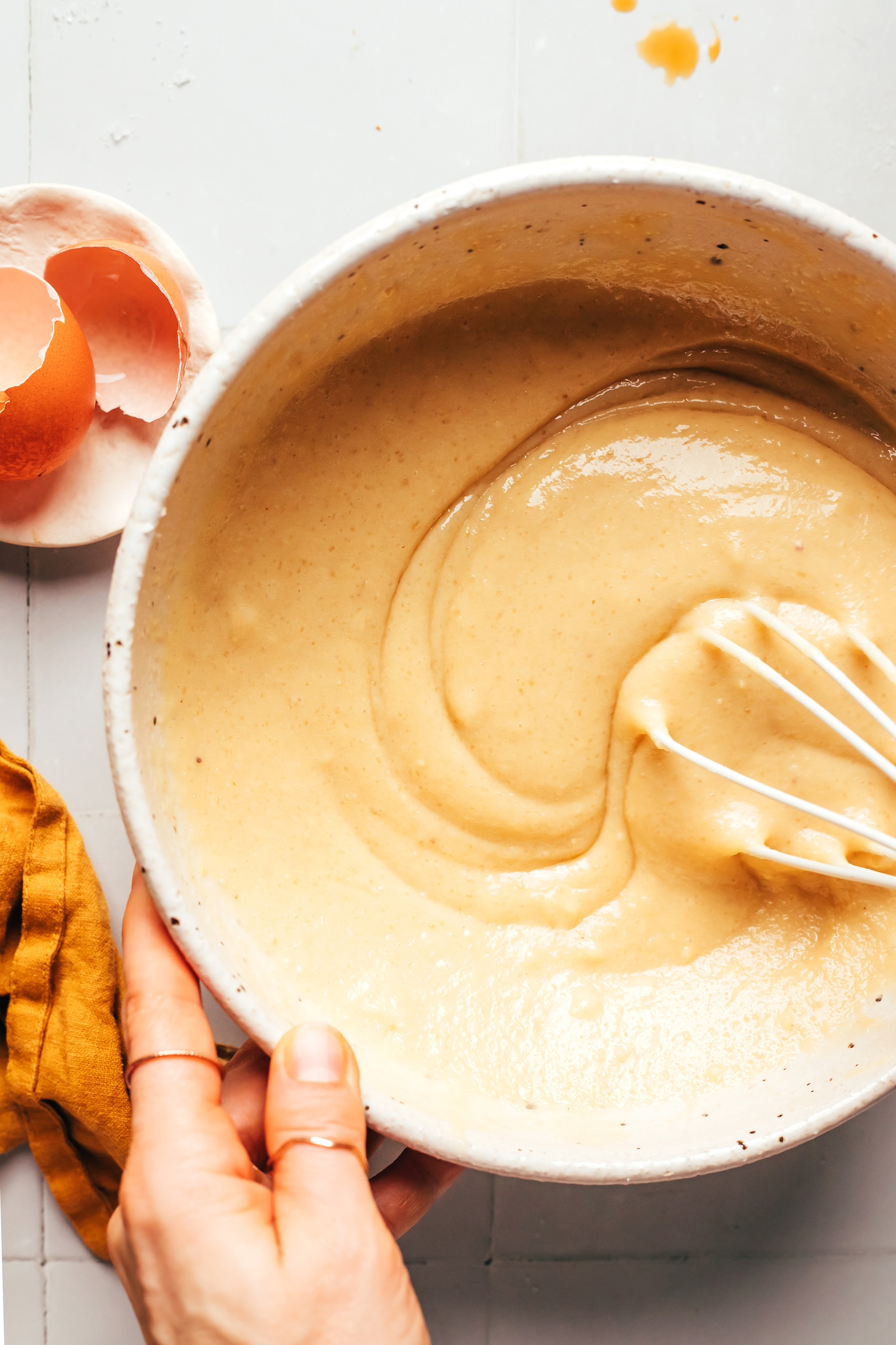 Whisking cake batter in a bowl