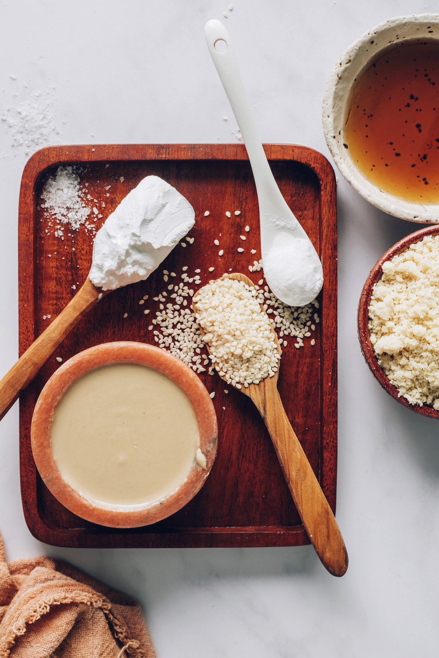 Tahini, sesame seeds, salt, tapioca starch, almond flour, and maple syrup