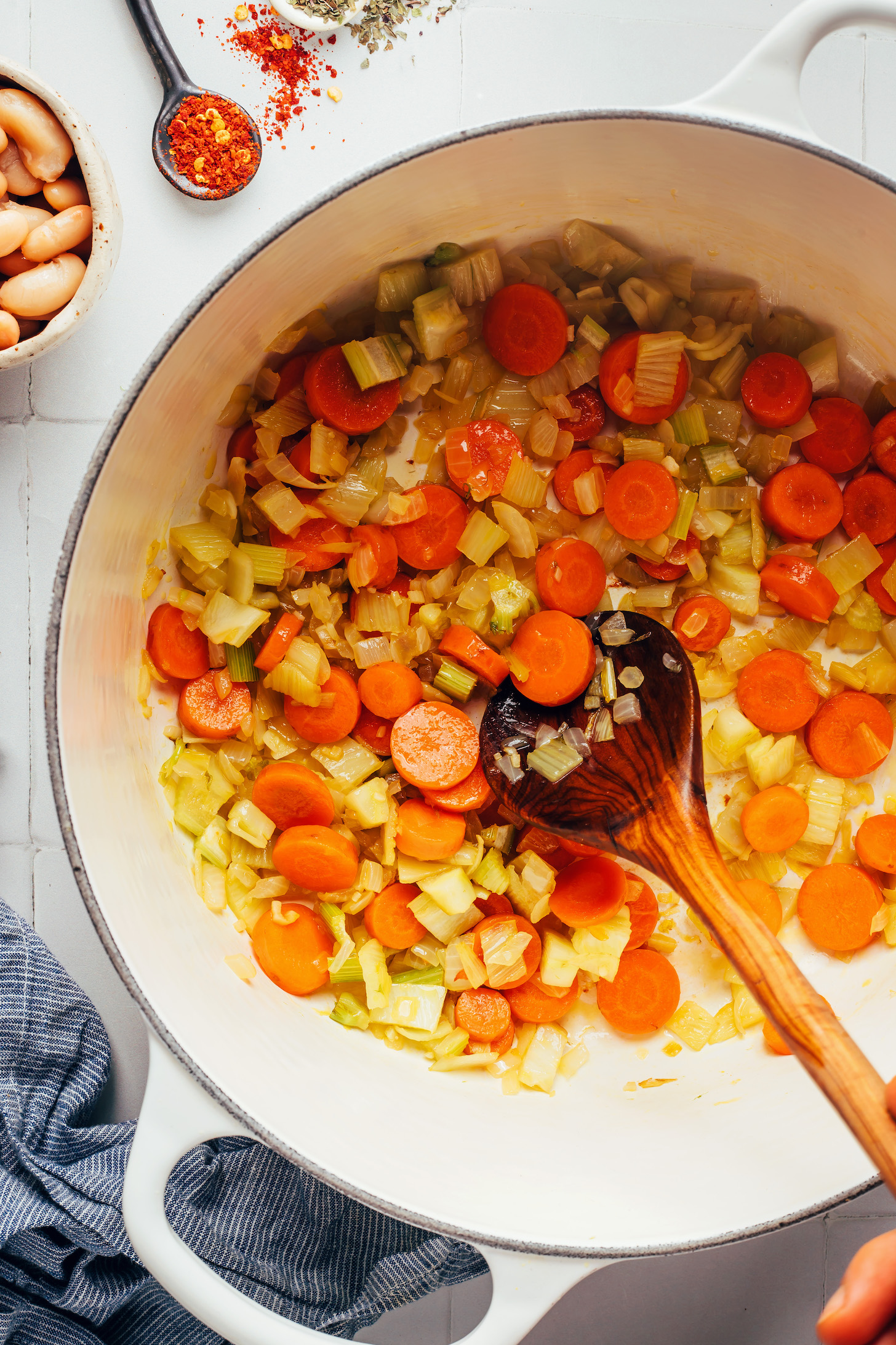 Sautéing chopped onion, carrot and fennel