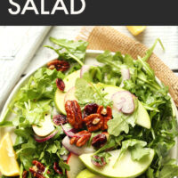 Plate of vegan and gluten-free apple pecan arugula salad