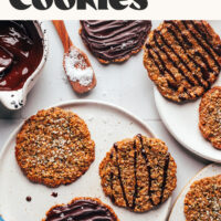 Plates of our hemp seed florentine cookies with some decorated with melted chocolate