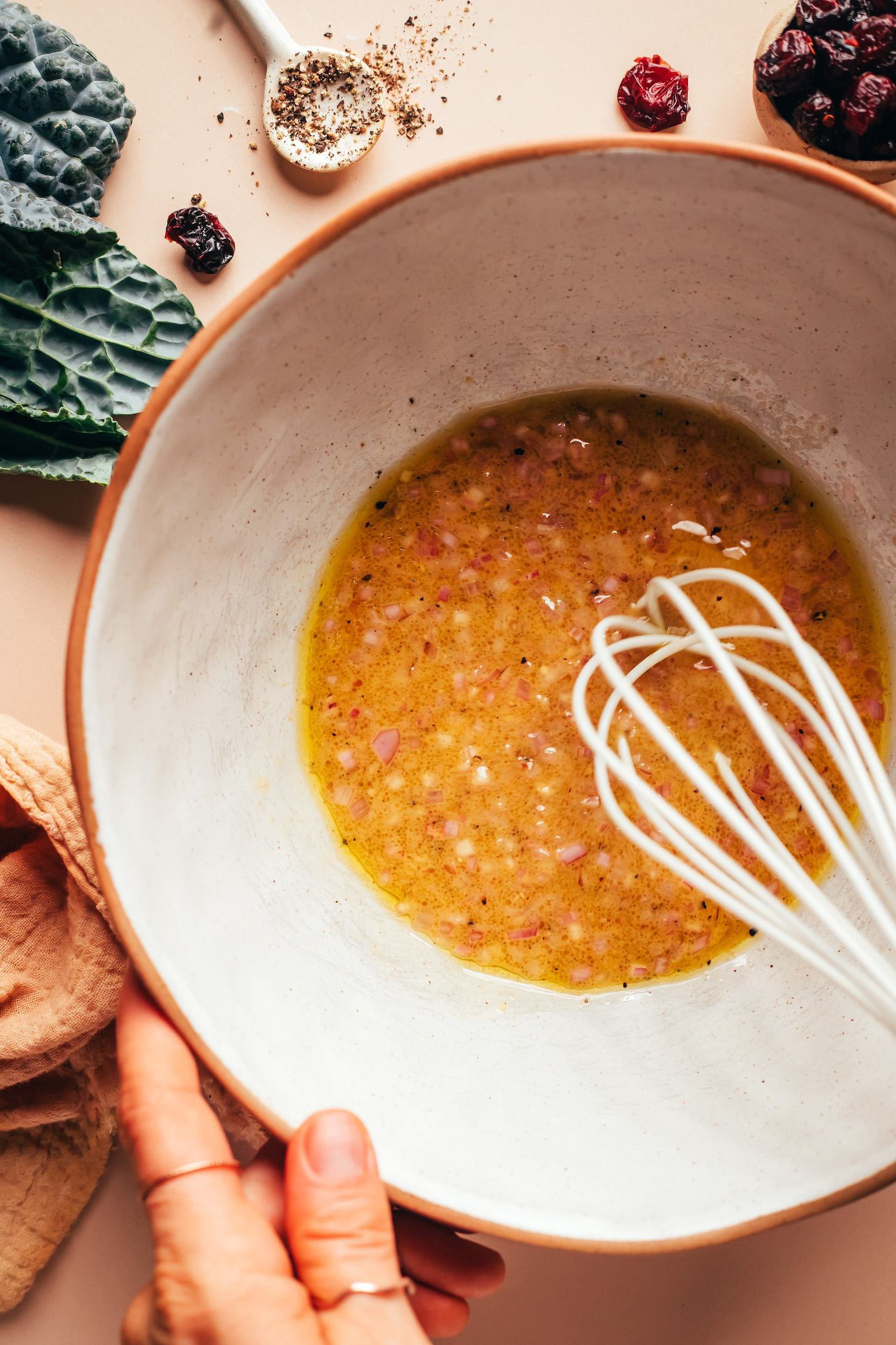 Using a whisk to make a simple apple cider vinaigrette