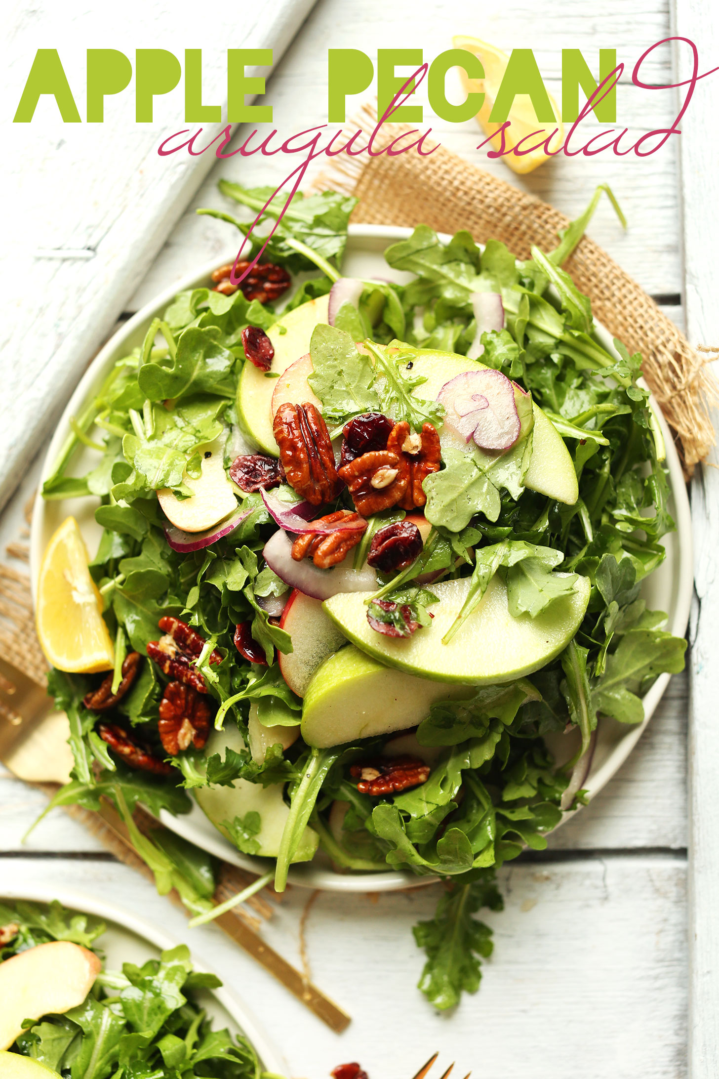 Hearty fall salad recipe made with apples, arugula, pecans, radish, and lemon vinaigrette