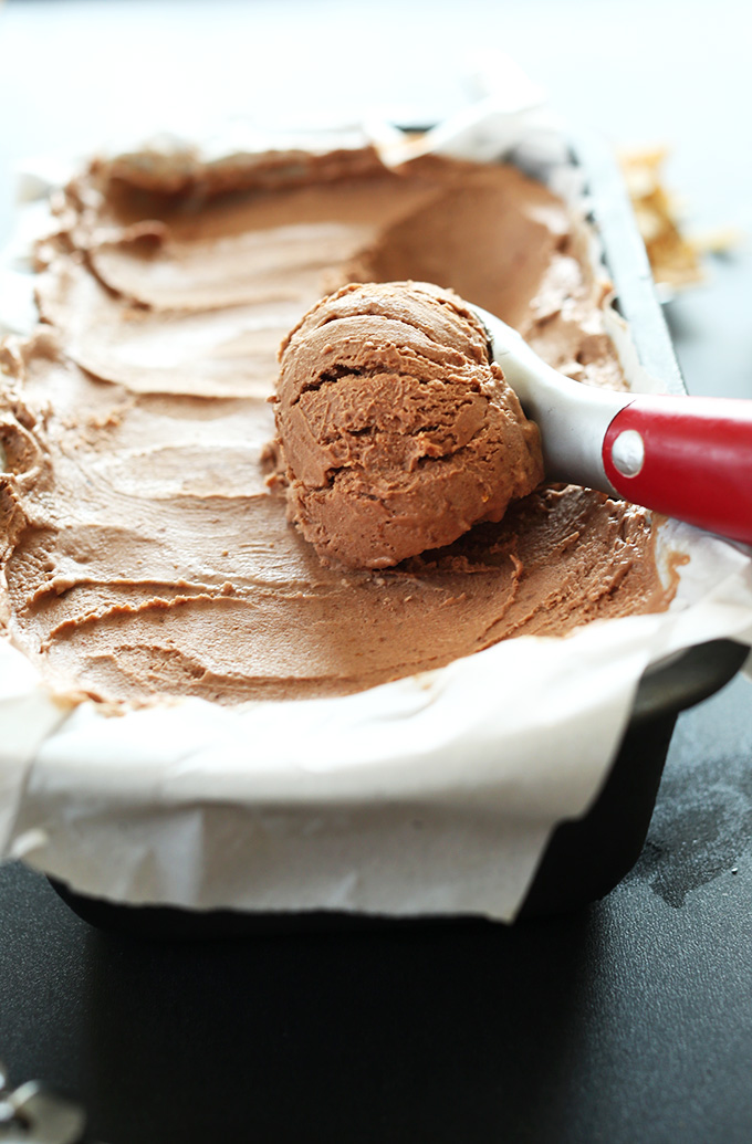 Using an ice cream scooper to grab a scoop of No-Churn Vegan Chocolate Ice Cream