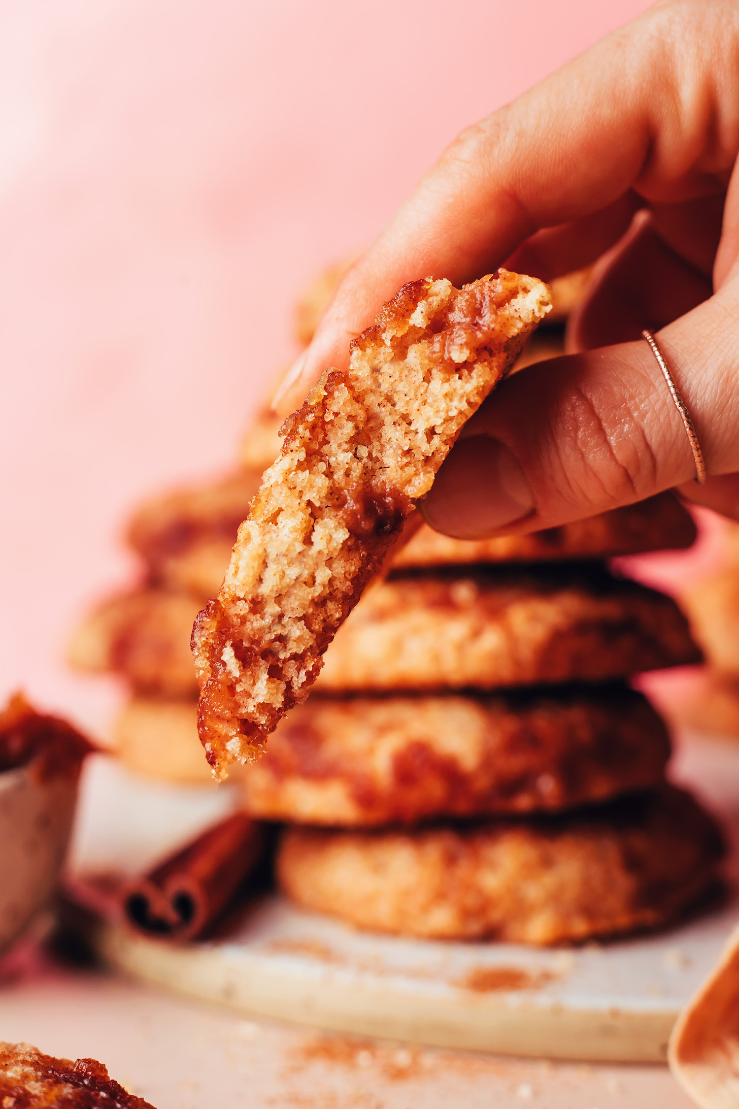 Close up photo of a vegan gluten-free snickerdoodle with swirls of apple butter