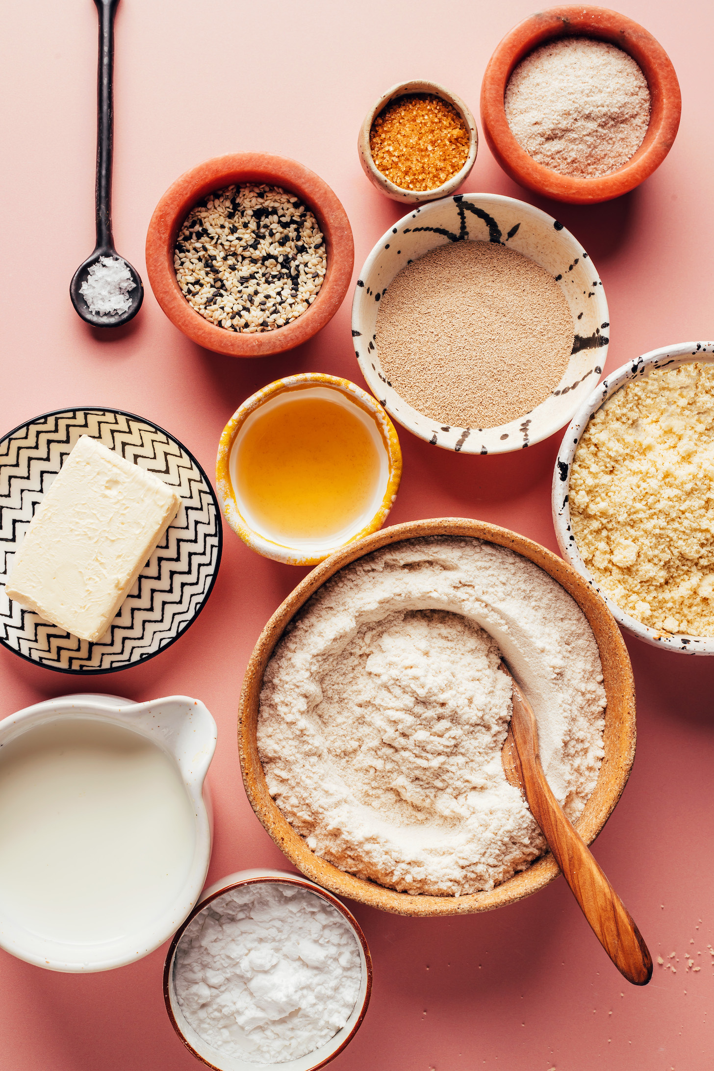 Dairy-free milk, vegan butter, salt, sesame seeds, cane sugar, psyllium husk powder, active dry yeast, apple cider vinegar, almond flour, brown rice flour, and potato starch